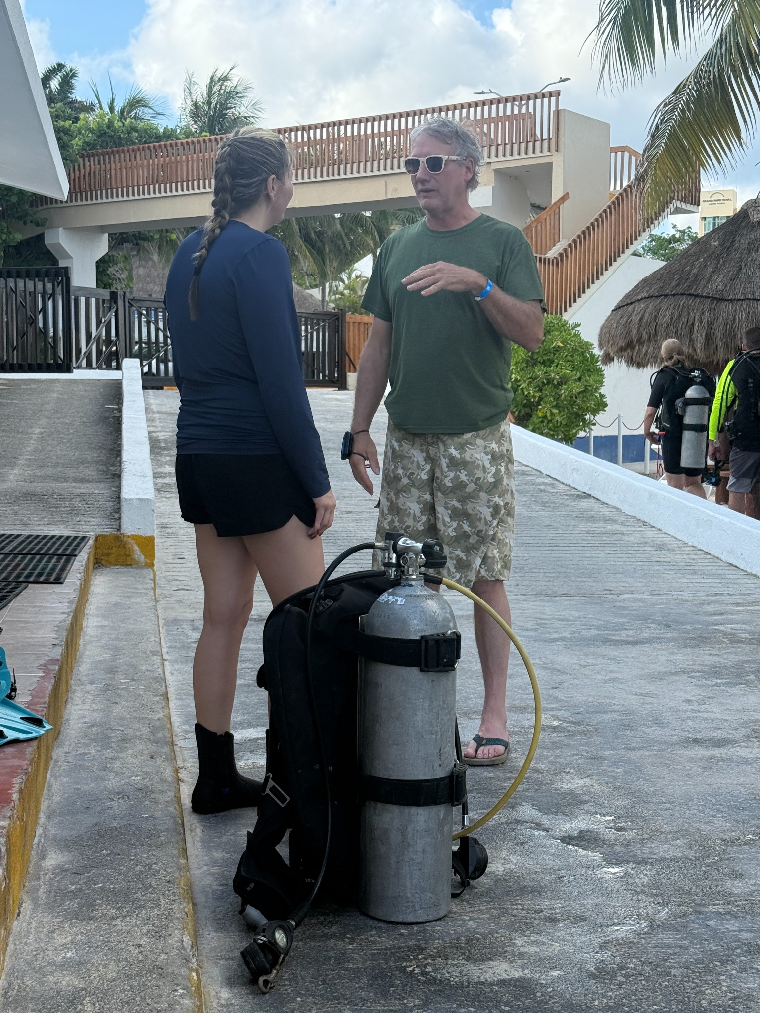 Bigfoot Scuba instructor working with a diver before entering the water